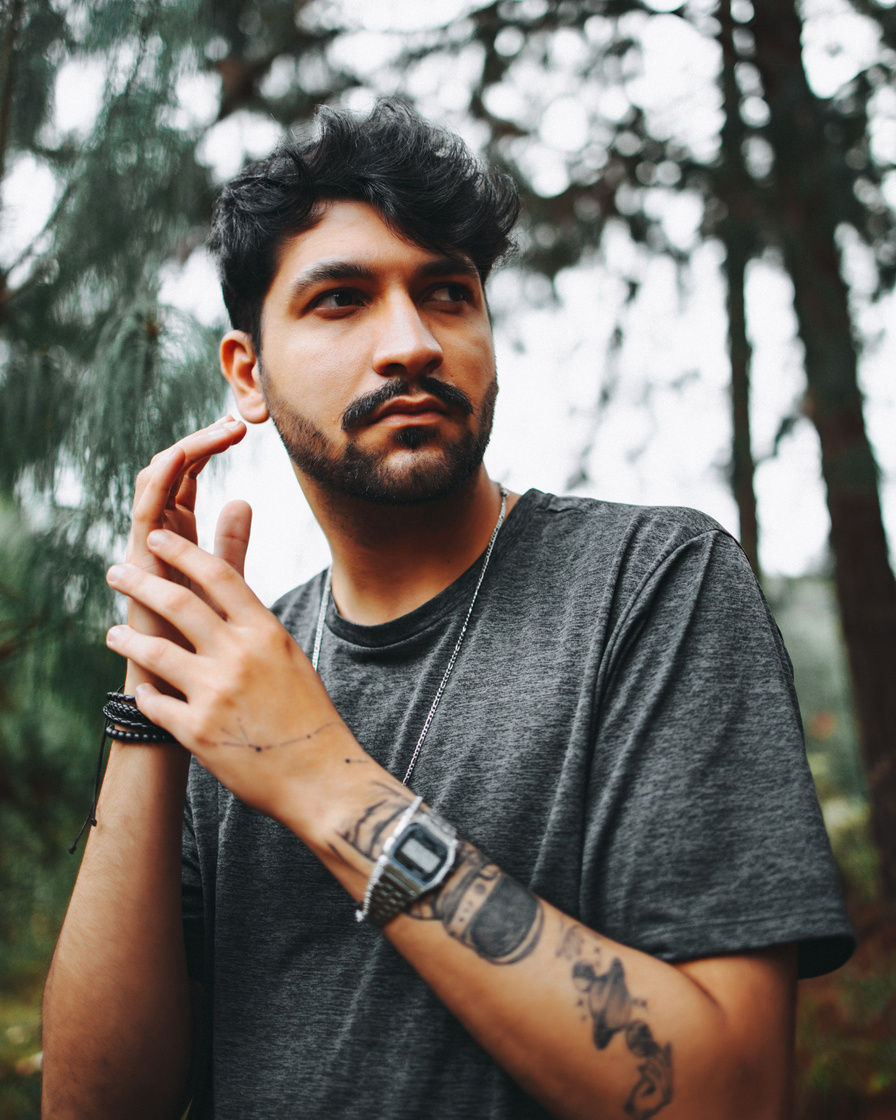  A Tattooed Bearded Man Wearing a Black Shirt